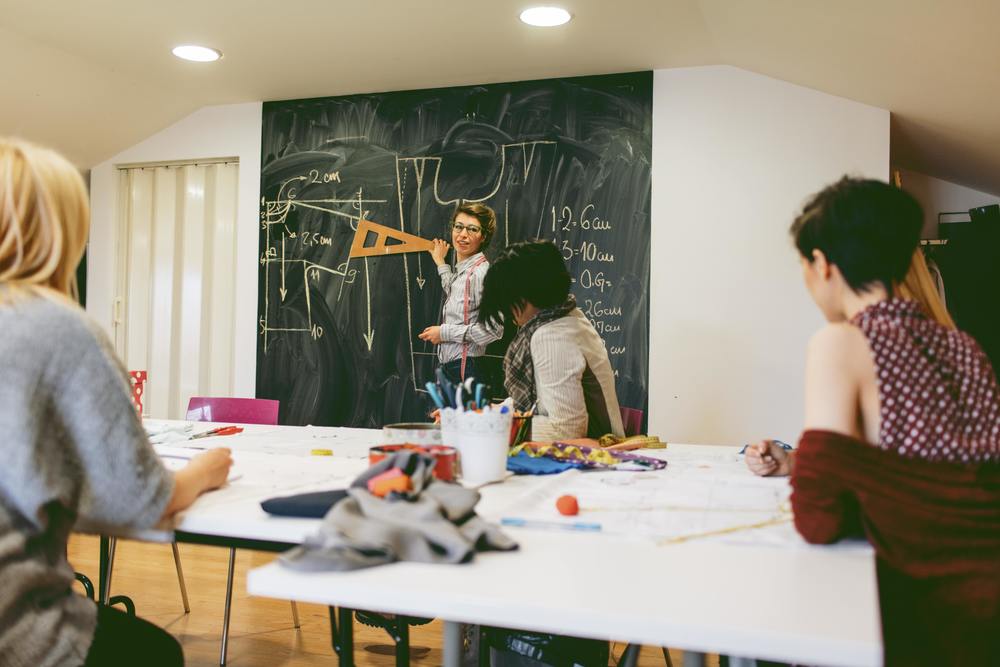 Female teacher adult students smaller.jpg